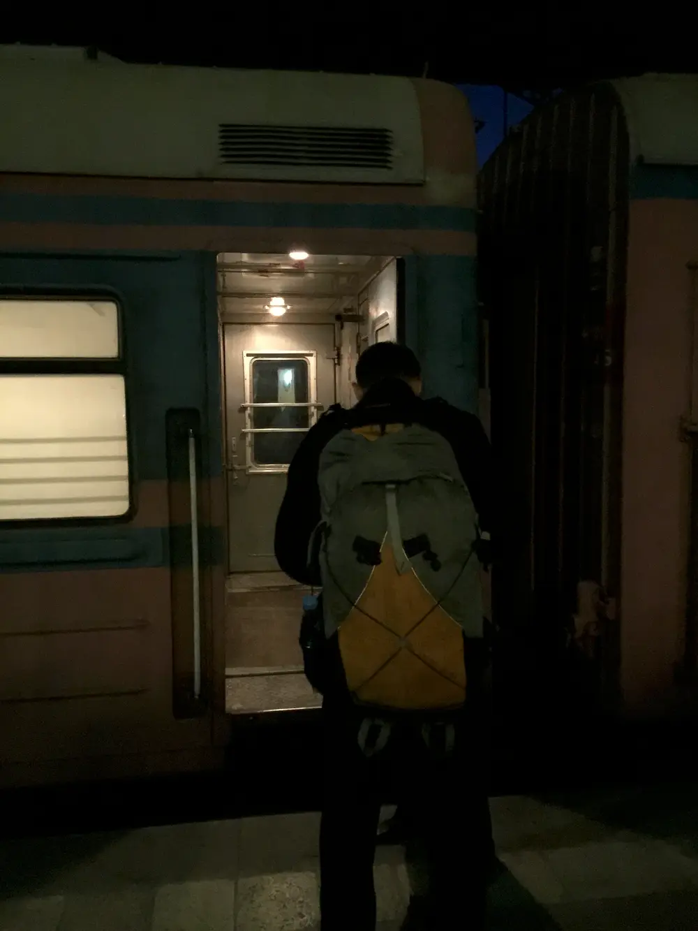 A passenger boarding the overnight sleeper train between Yerevan and Tbilisi at the platform