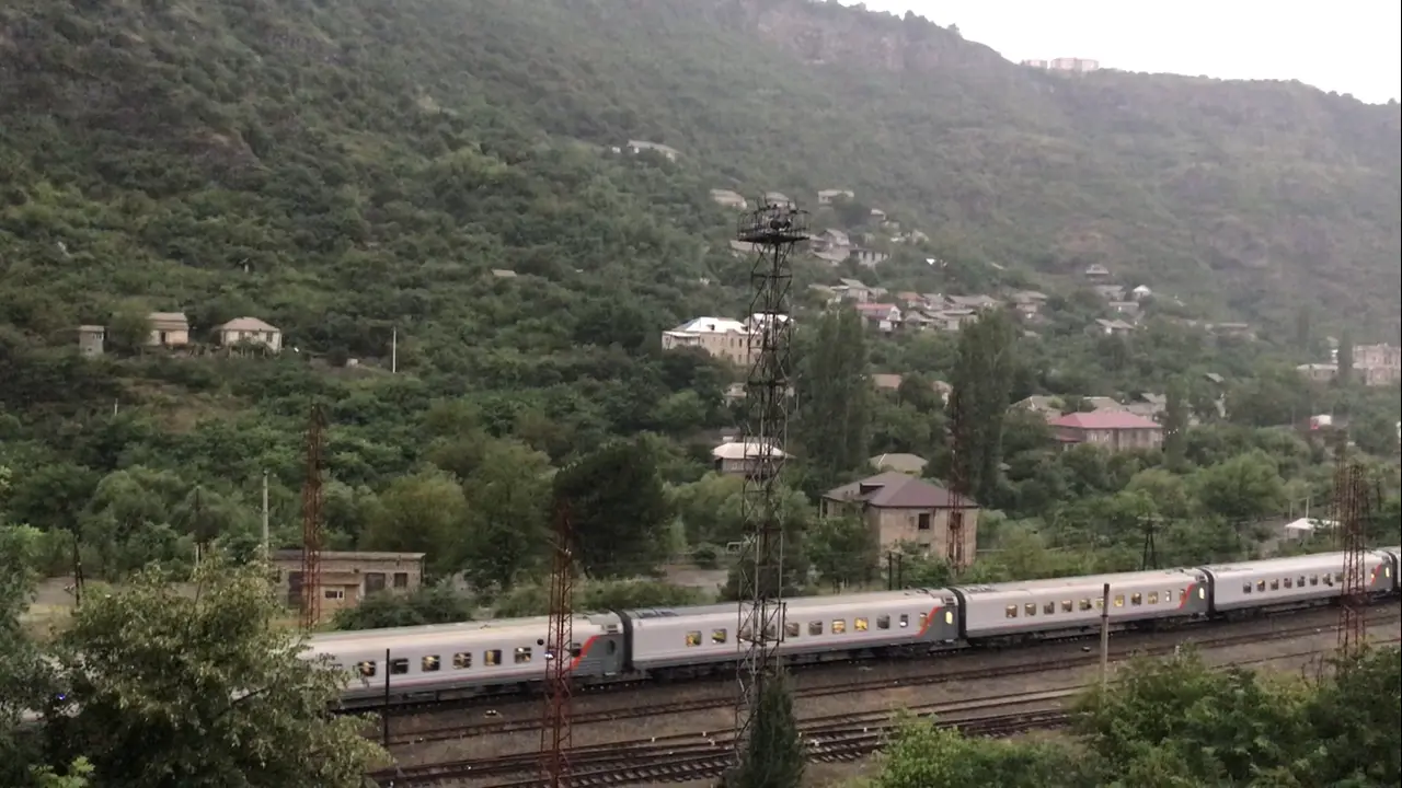 The Yerevan to Tbilisi train passing through Alaverdi station in the green Debed canyon of northern Armenia